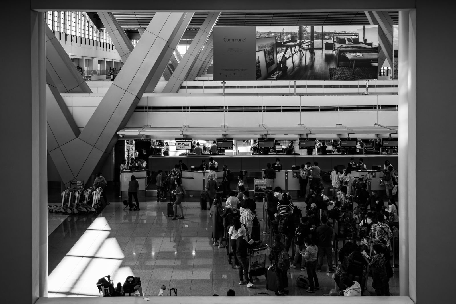 A busy airport terminal hall.
